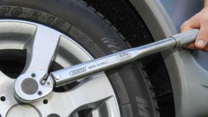 Torque wrench checking wheel nuts
