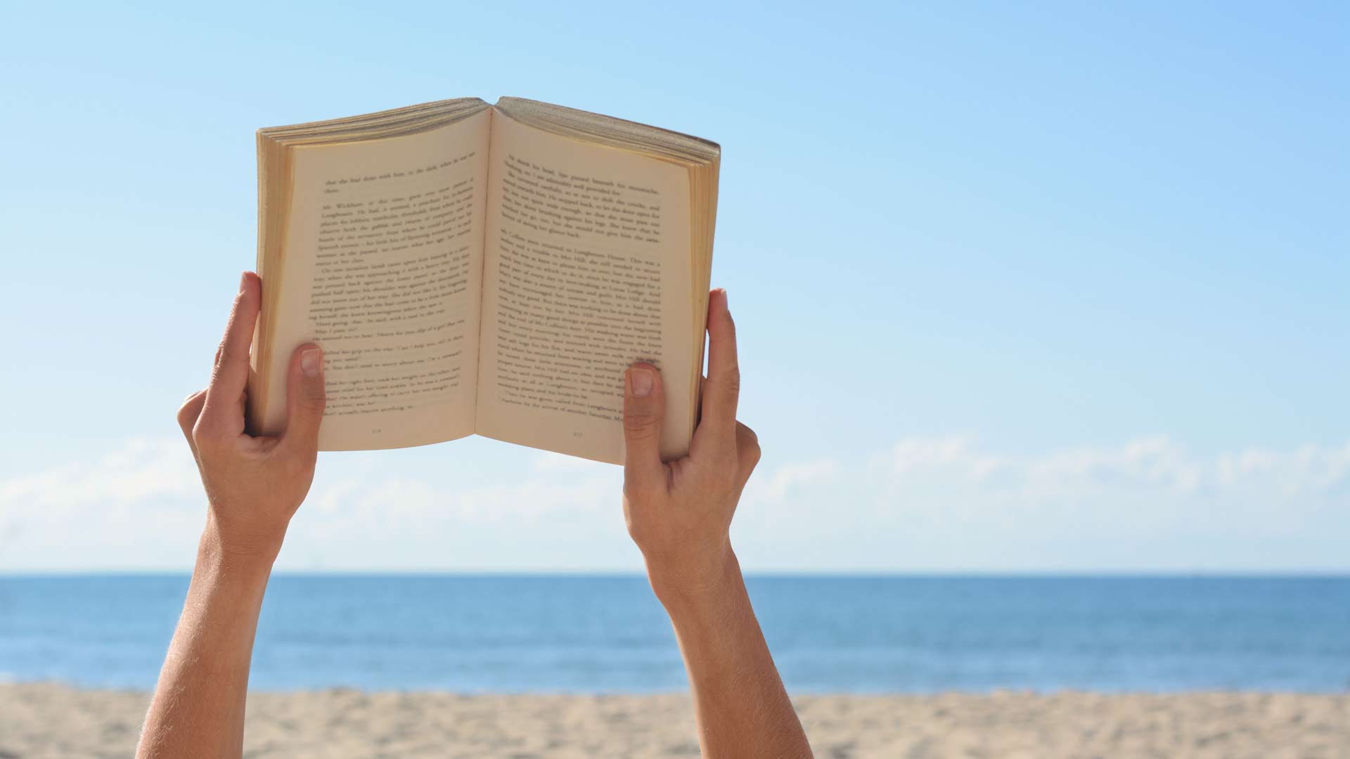 Book being read on the beach 