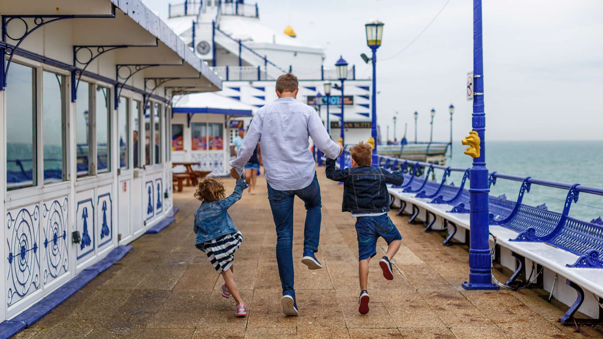 Family enjoying time on Eastbourne Pier