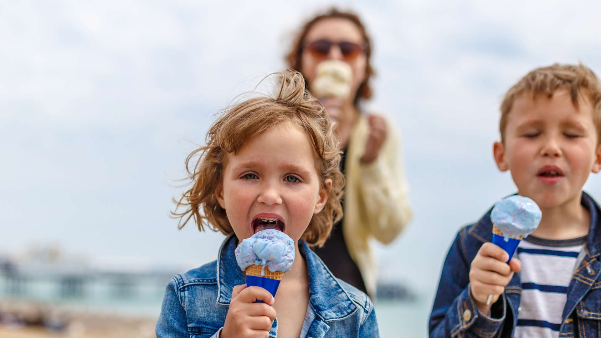 Family eating ice cream on the beach