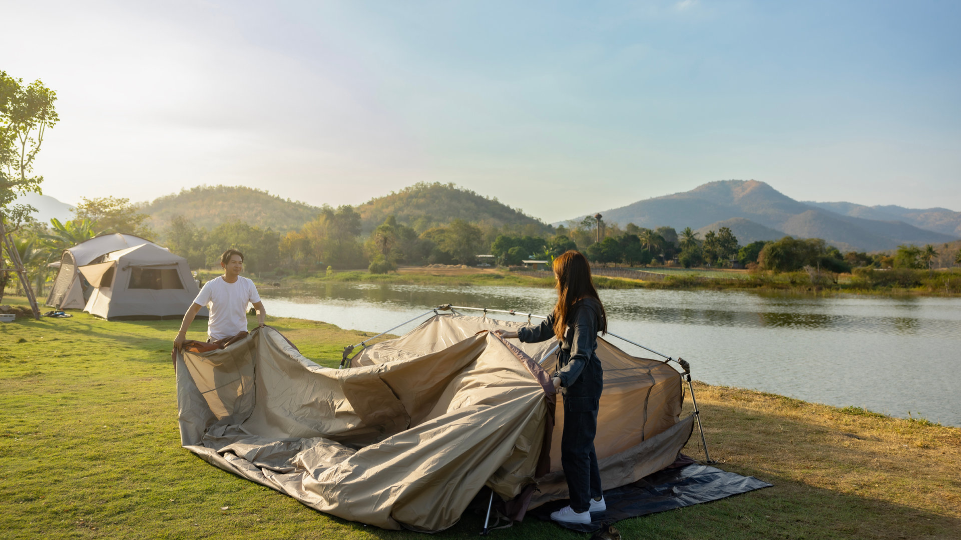 couple putting up tent