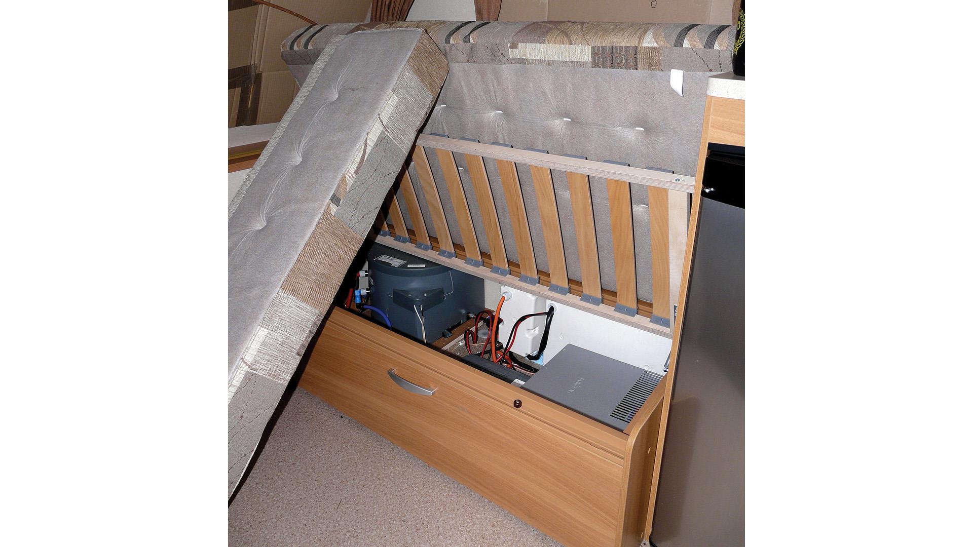 Underseat locker raised for ventilation in a caravan