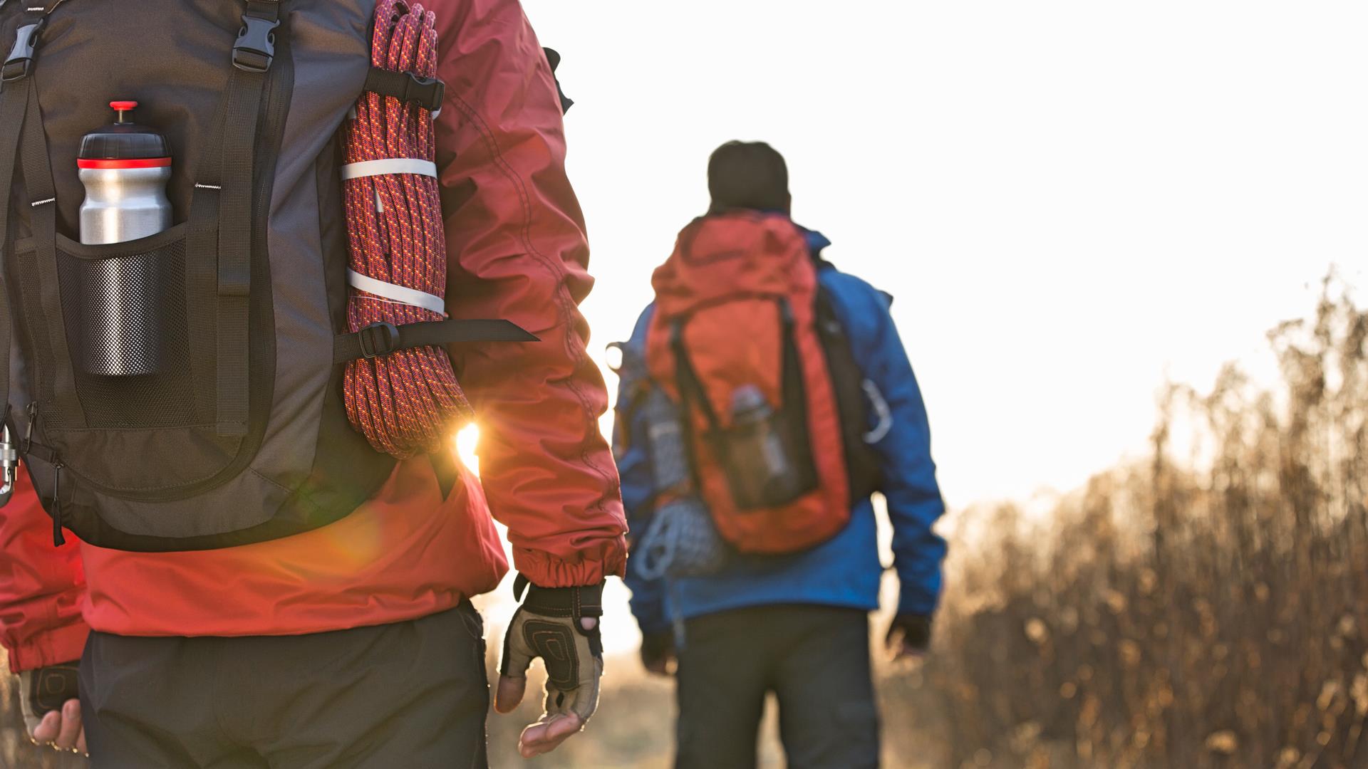 two hikers wearing backpacks